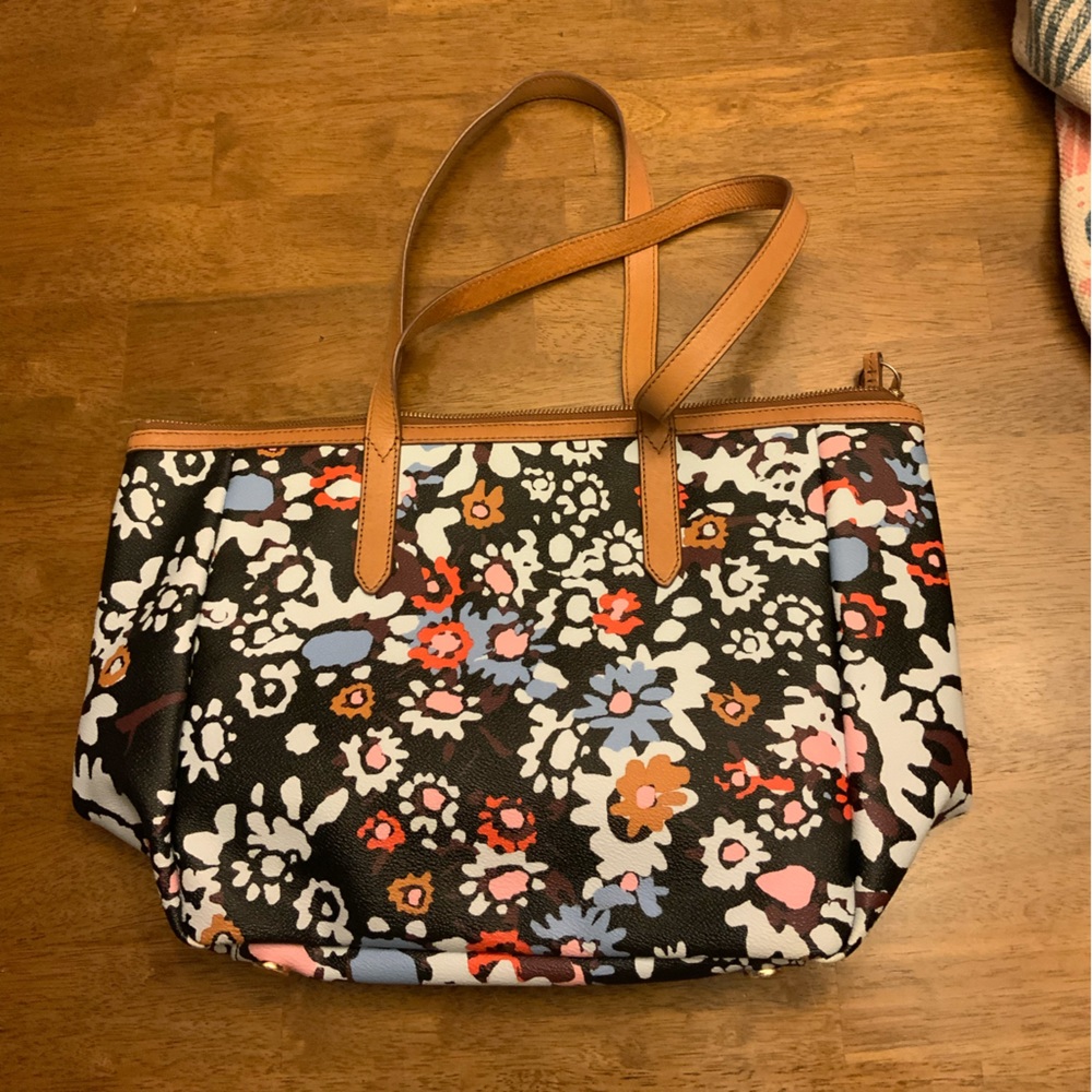 Fossil tote with leather trim.